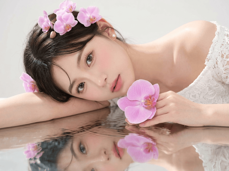 A stunningly beautiful young East Asian woman in her early 20s, delicate and...