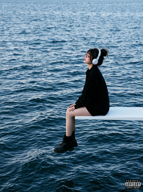 A square-format album-cover scene of alone subject [person in the image] sitting...